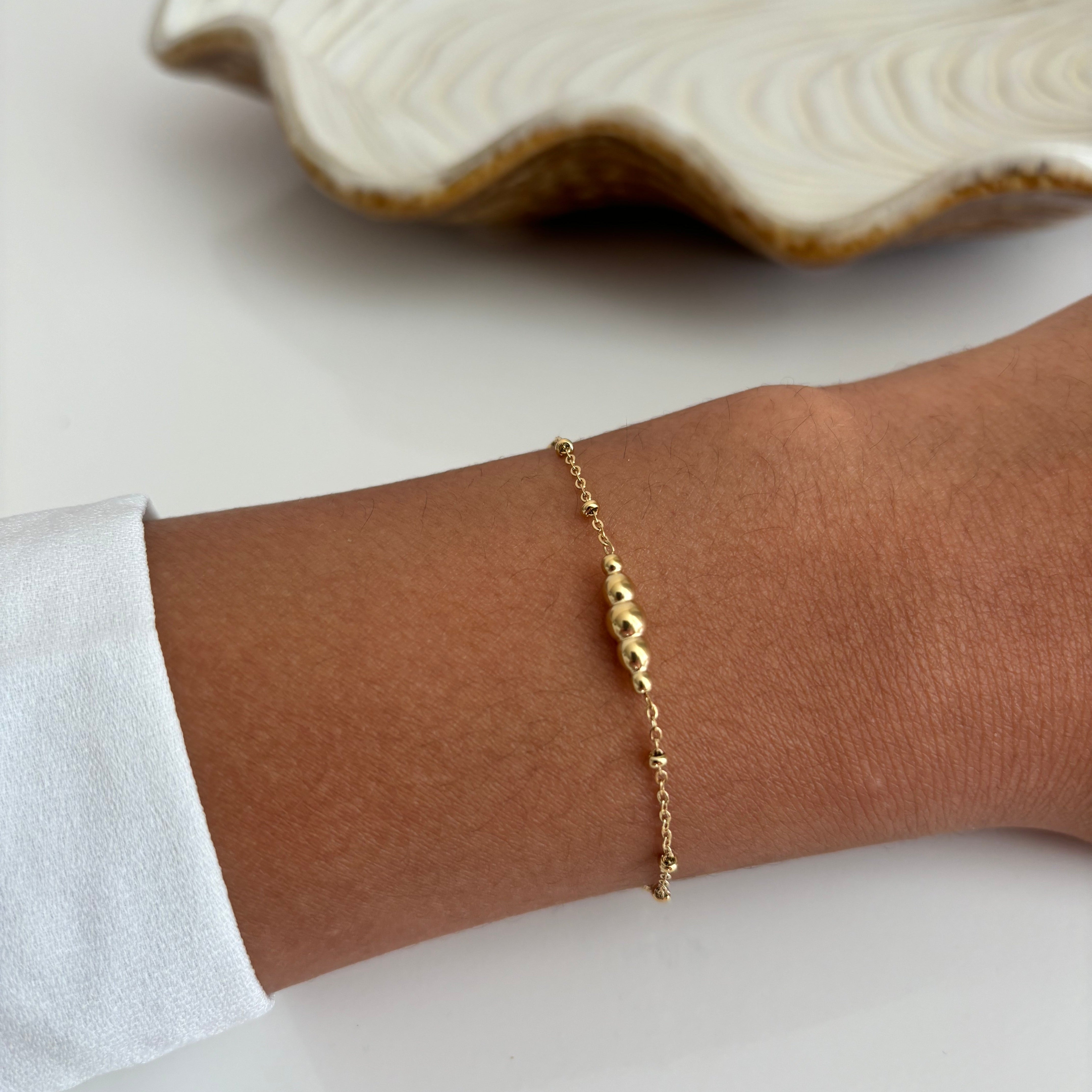 Gedraaid bedelarmband Goud